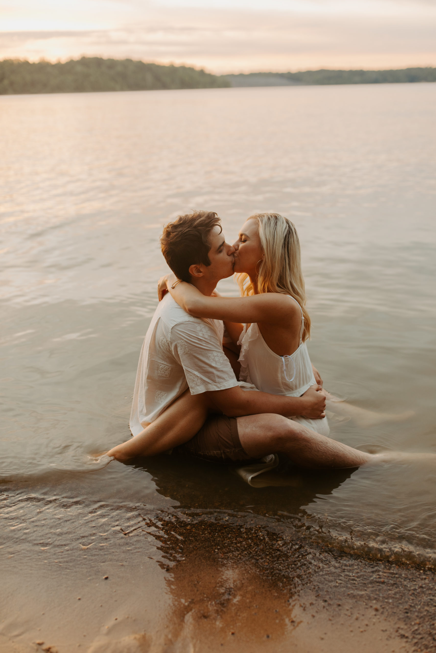 Kissing in Water East Fork Lake Engagement