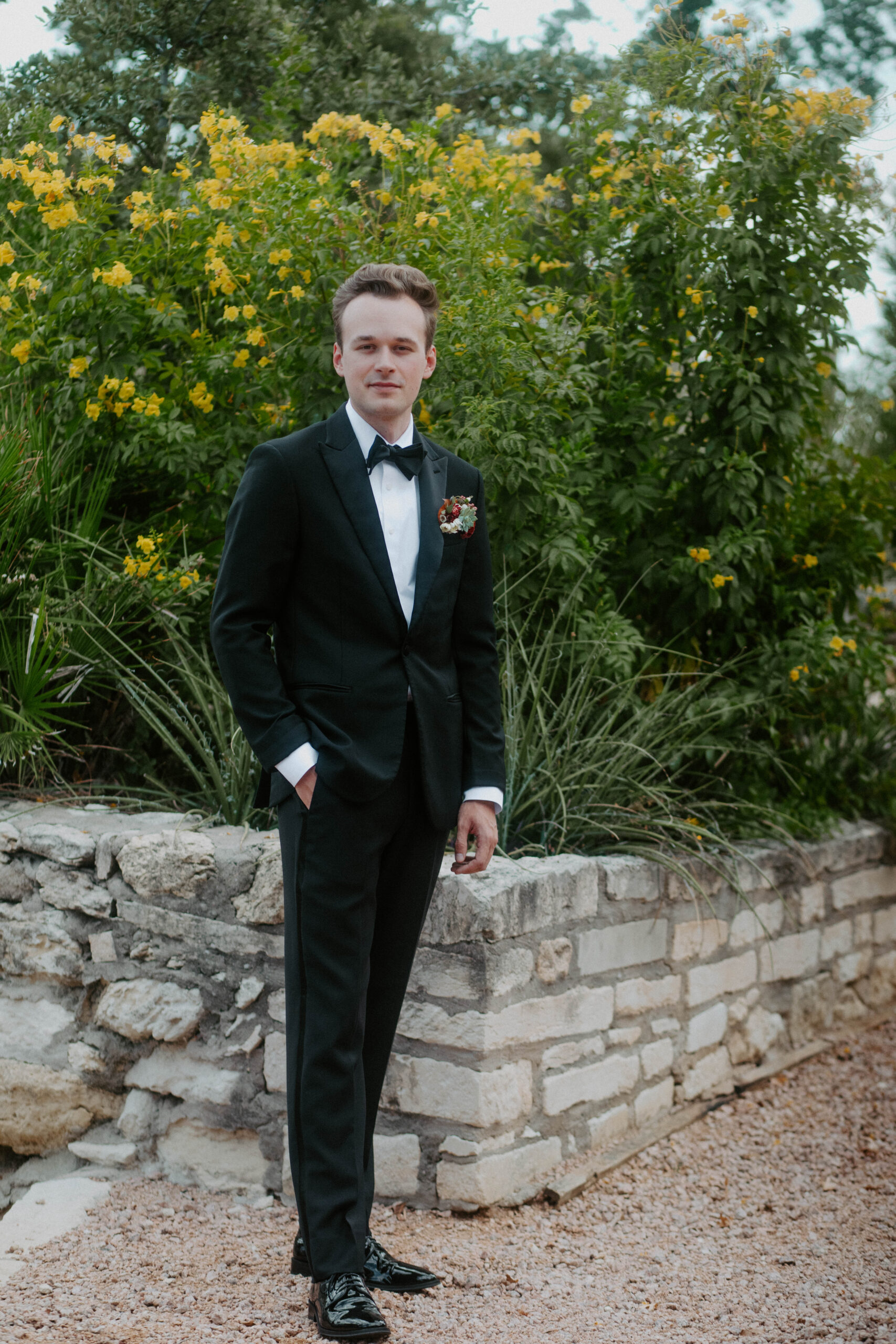 Groom's portrait on his wedding day in the gardens of Villa Antonia in Austin, Texas.