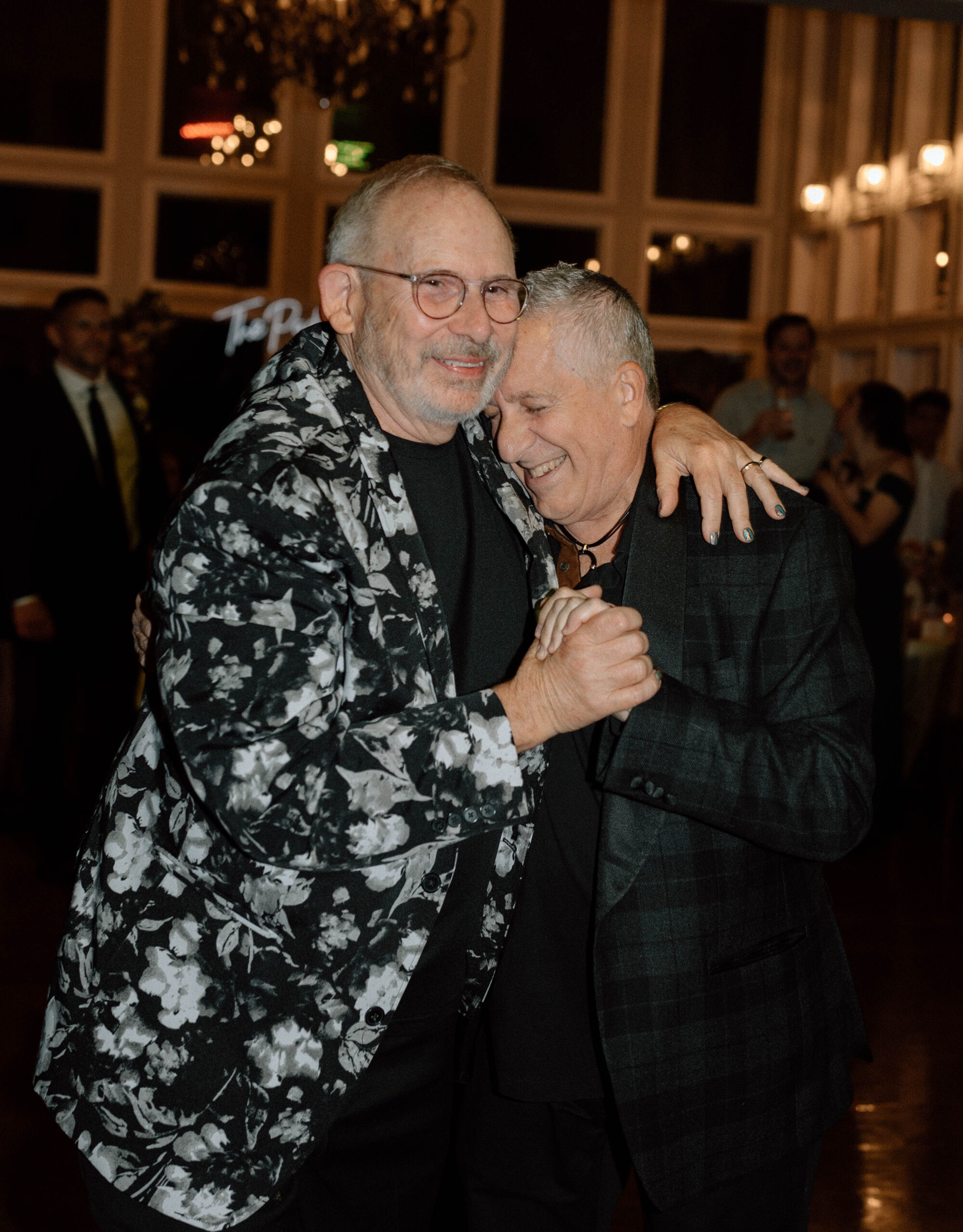 Heartfelt first dance moment captured at Casa Blanca Wedding, as the newlyweds share a tender embrace amidst twinkling lights and joyous celebration