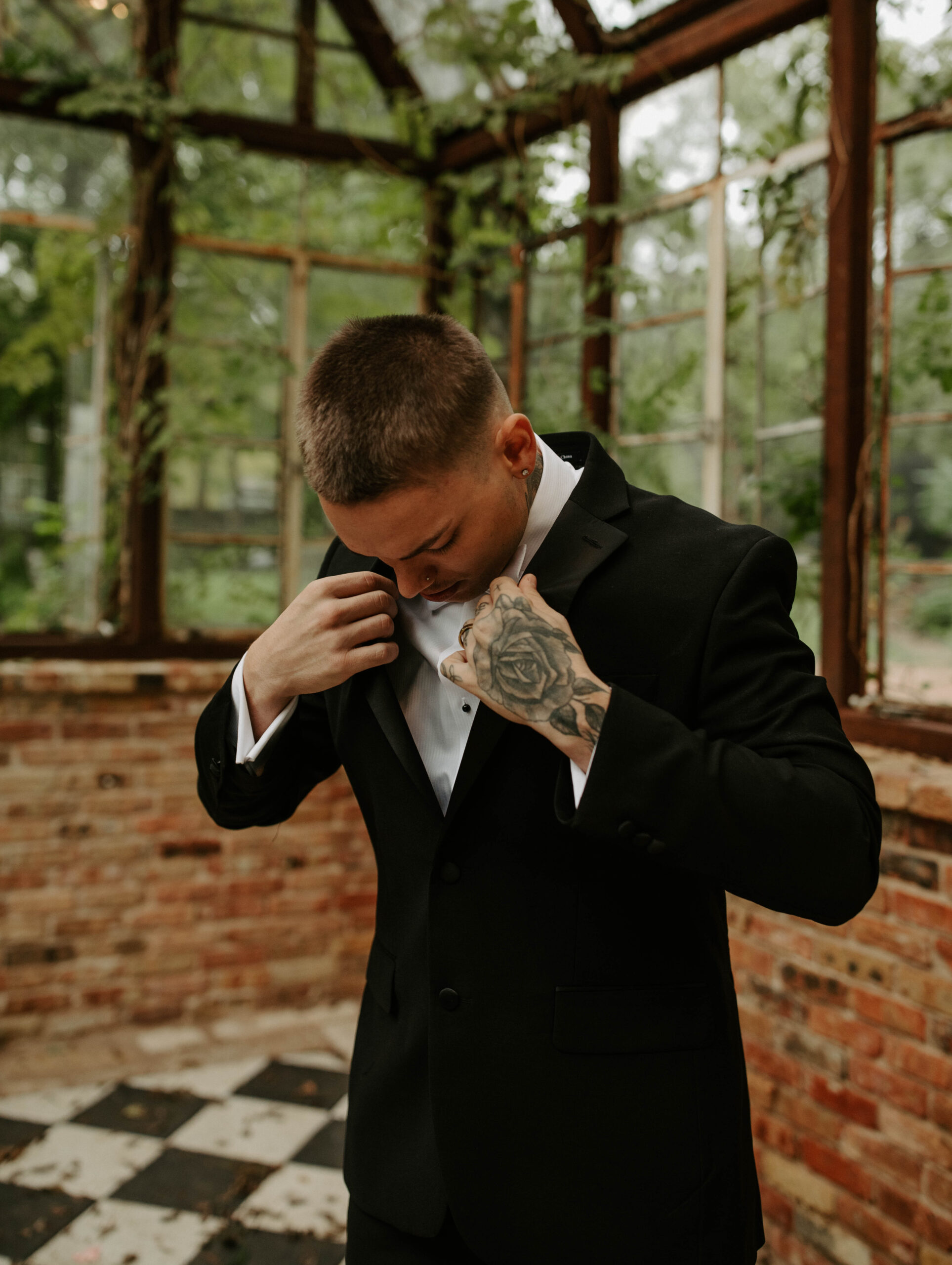 Elegant Austin elopement venue Sekrit Theater with groom in tuxedo.