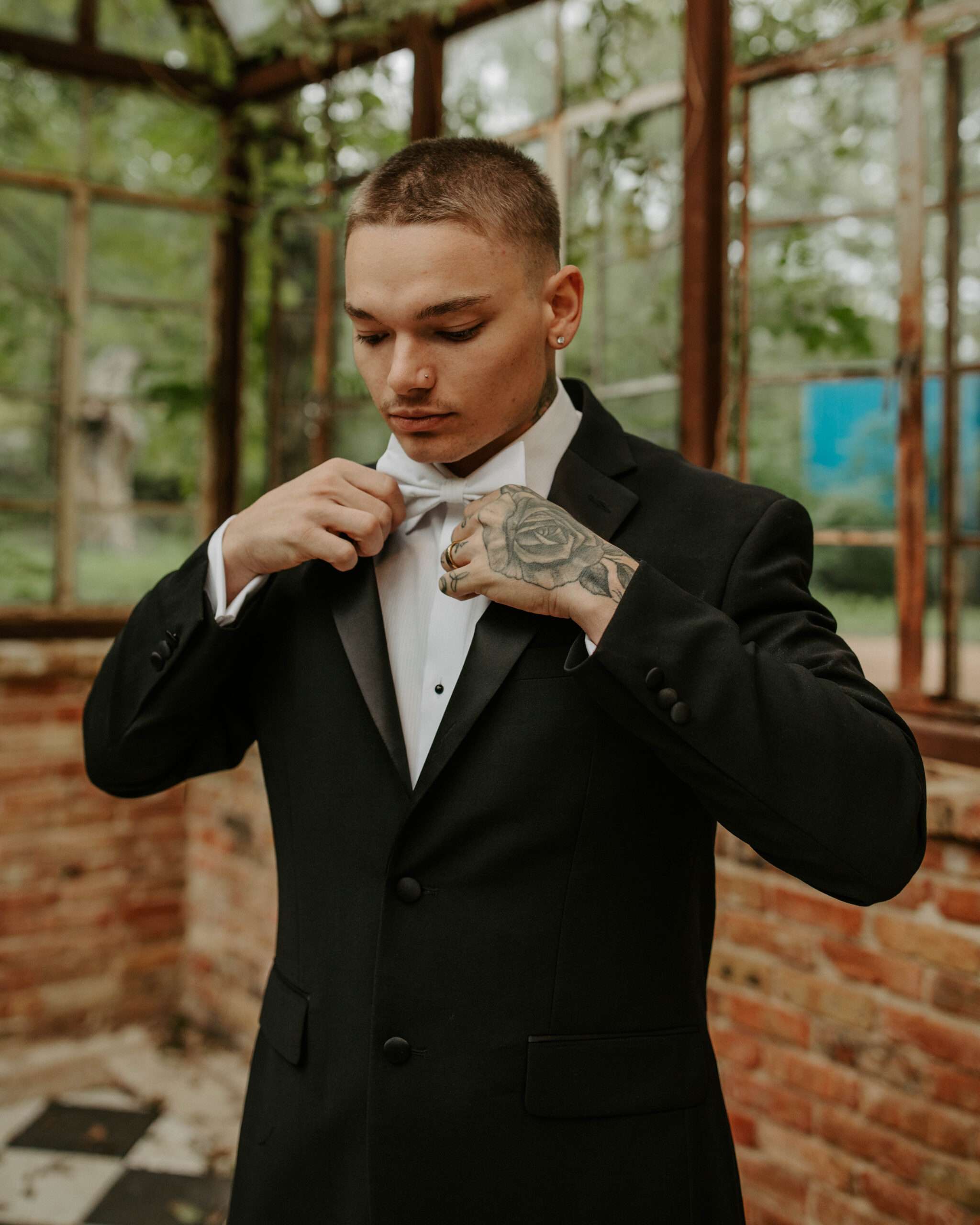 Elegant Austin elopement venue Sekrit Theater with groom in tuxedo.