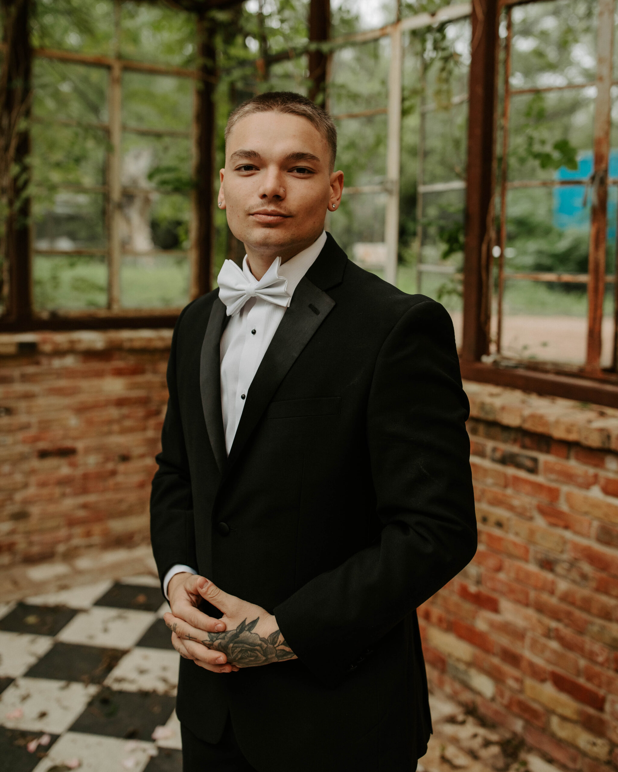 Elegant Austin elopement venue Sekrit Theater with groom in tuxedo.