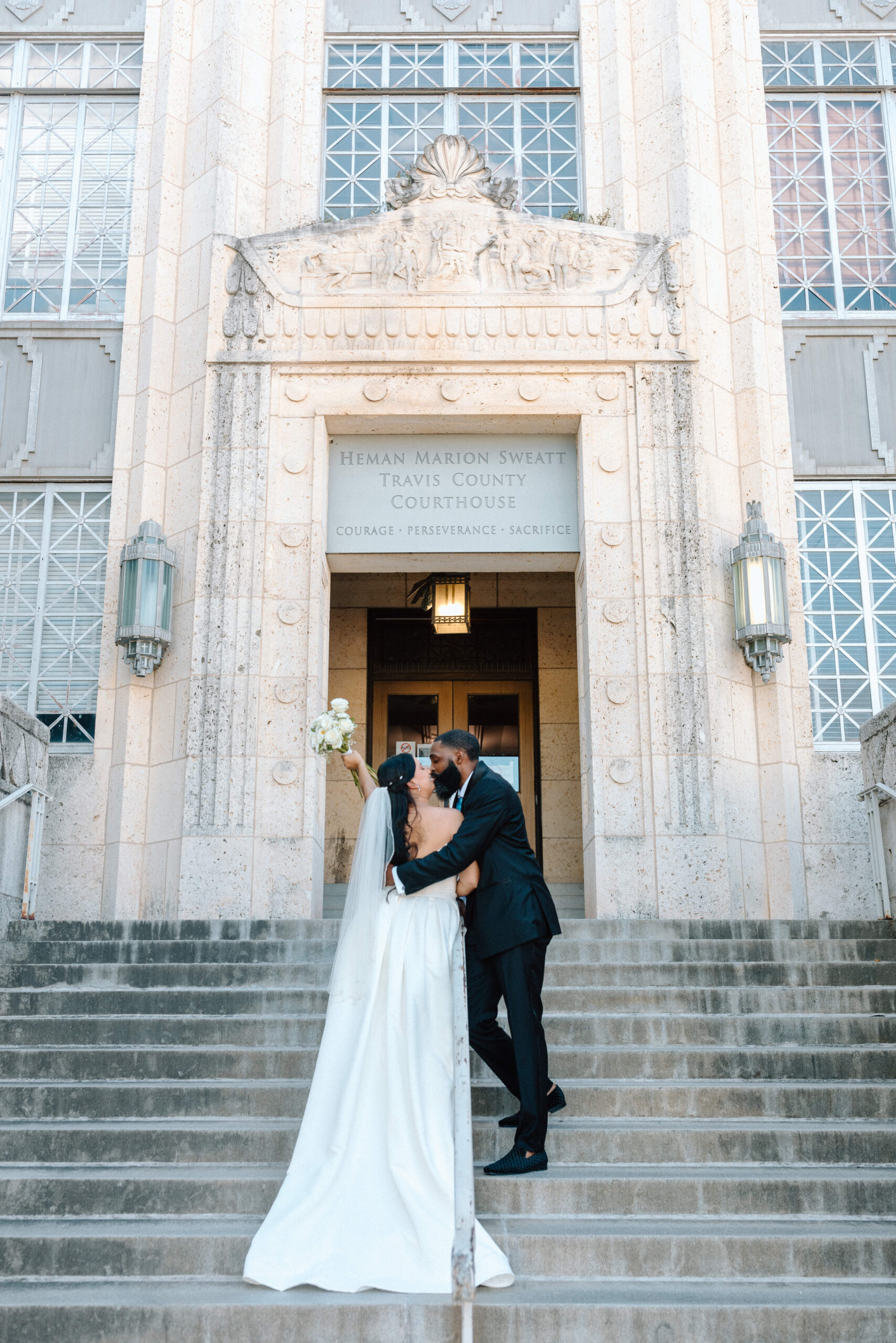 Travis County courthouse couple eloping in front of the Precinct 5 building. 