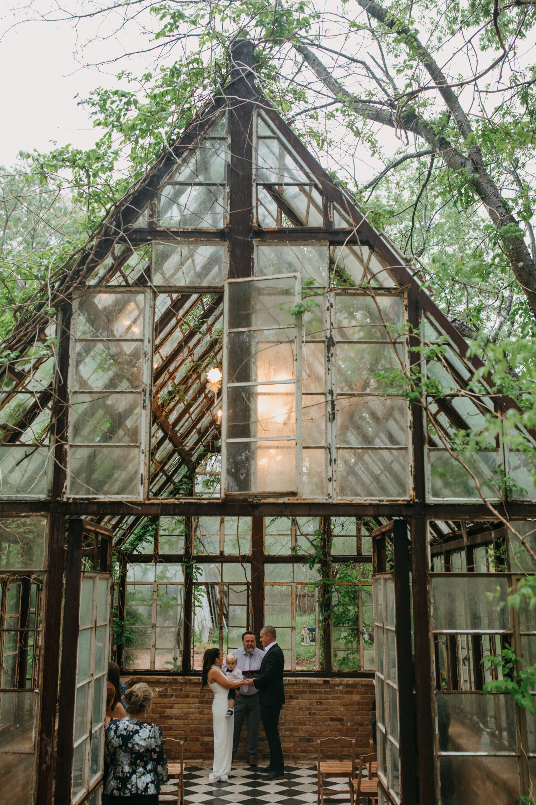 Couple holding hands during a wedding ceremony at Sekrit Theater, a venue in ATX.