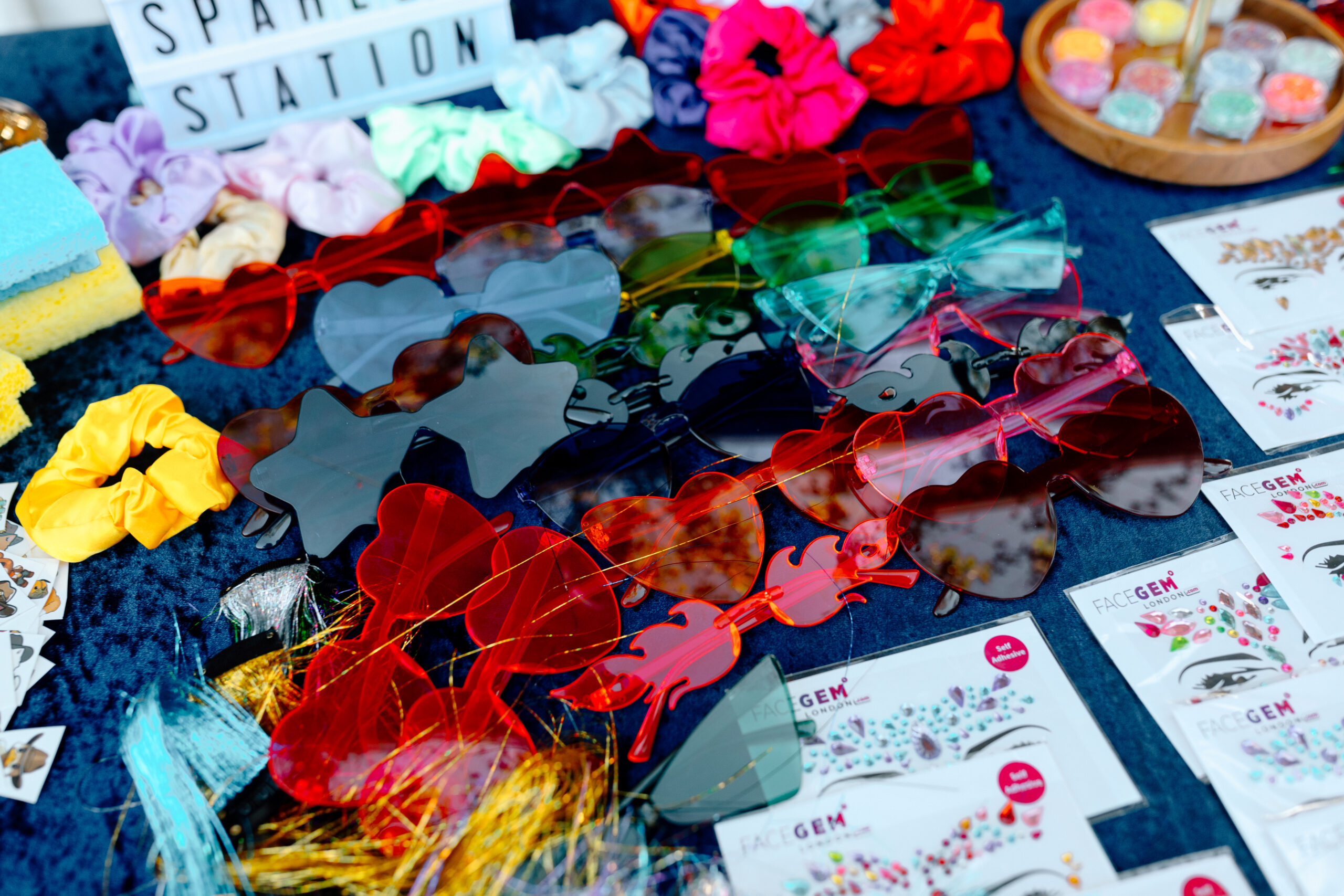 a collection of fun party sunglasses for a wedding reception.